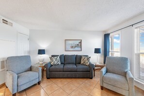 Inviting living space with new queen size sleeper sofa and two relaxing recliners