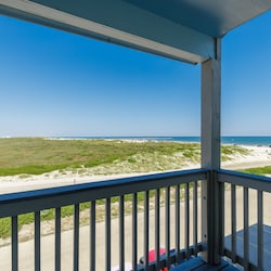 Private balcony off the master bedroom with a great view of the coastal dunes, beach, and Gulf of Mexico