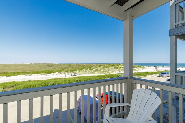 Private balcony off the living area with a view of the coastal dunes and the beach