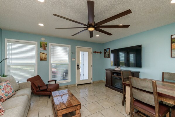 Spacious open-concept living area with stylish, modern furnishings