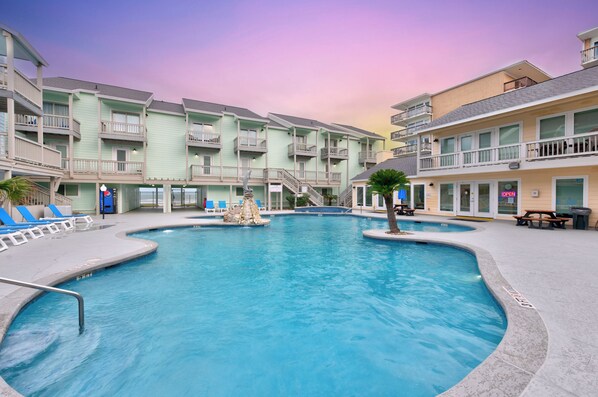 Admire the shimmering El Constante pool—perfect for a refreshing dip after a sun-soaked day of beach adventures and coastal fun.