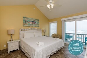 Master bedroom with king size bed and private balcony facing the beach
