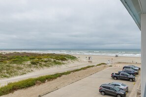 Private balcony off the master bedroom with a view of the coastal dunes and the beach
