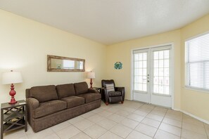 Cozy living area with flat screen TV and queen size sleeper sofa