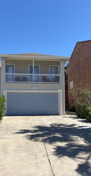 Front of house, Front door down the walkway on the right side.