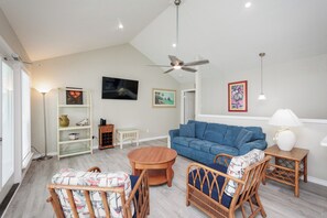 Living area with a queen size sofa sleeper and flat screen TV