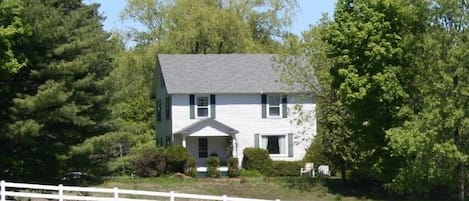 View of house from the road leading into the property by the horse pasture