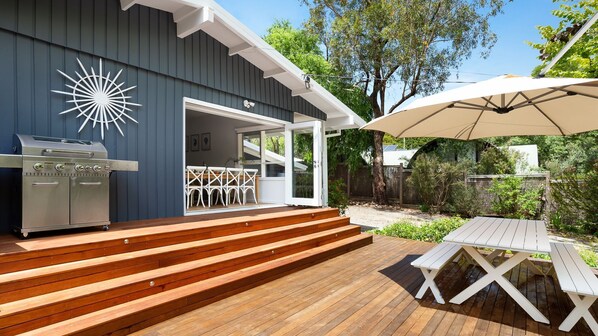 Blue Beachside Retreat Outdoor Entertainment Area with BBQ