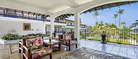 Casa De Emdeko shaded seating area at the entrance to the complex