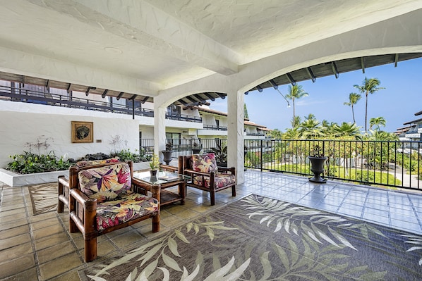 Casa De Emdeko shaded seating area at the entrance to the complex