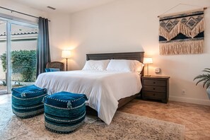 A cozy king-size sanctuary—where warmth and relaxation embrace you.