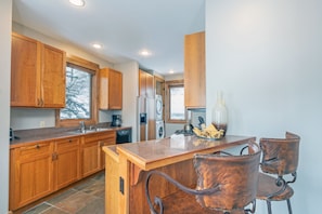 Kitchen with two bar stools at peninsula