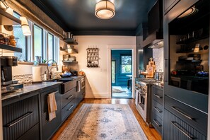 Beautiful kitchen with opening to enclosed porch that seats 10-12.