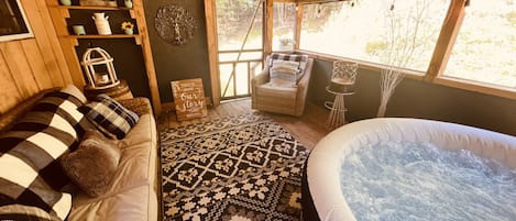 Relax in your own private spa on the screened back porch