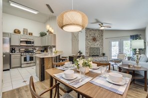 Cozy dining area open to living room, kitchen and bartop