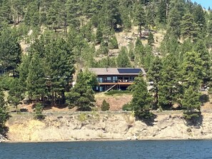 View of the house from Canyon Ferry Lake The road is between the property & lake