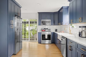 Whip up delicious meals in the spacious, bright kitchen with ample counter space