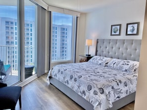 Master bedroom with King bed and balcony access.