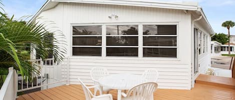 Patio deck lined by Bizmark Palms for privacy!