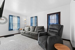 Living room with comfortable sofa and massage chair!