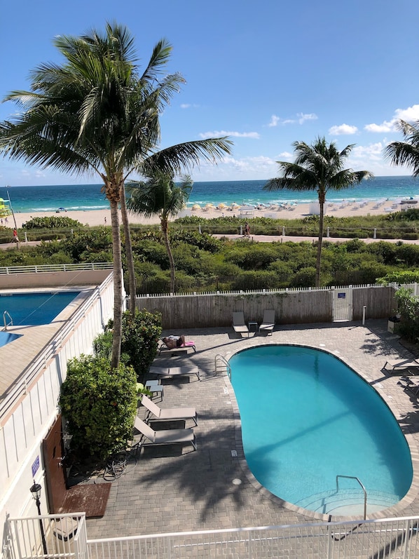 Pool and beach behind the building. This is not the view from the apartment. 