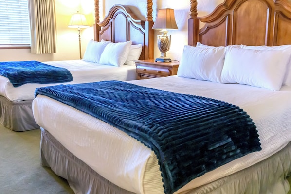 Guest bedroom features two queen beds