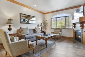 This villa has beautiful updated vinyl wood flooring, accented with elegant earth tone furniture and modern decor.