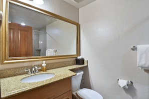 Guest bathroom vanity, bathroom also features a shower bathtub combo