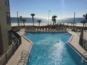 Main pool located in middle of buildings. 