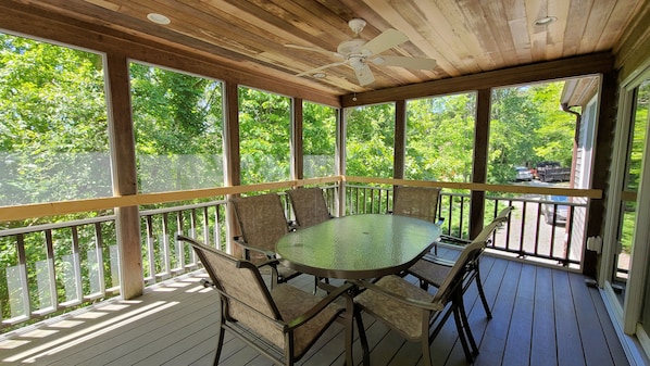 Wonderful screen porch with dining table
