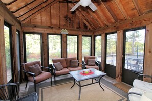 Enclosed screen porch with door to deck