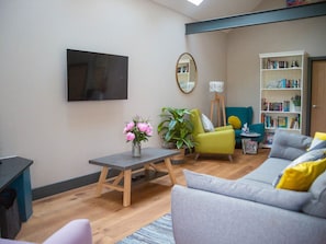 Living room with exposed beam | Stabl, Bethania, near Aberaeron