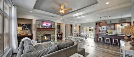 Living Room with Fireplace, Dining Room &amp; Kitchen