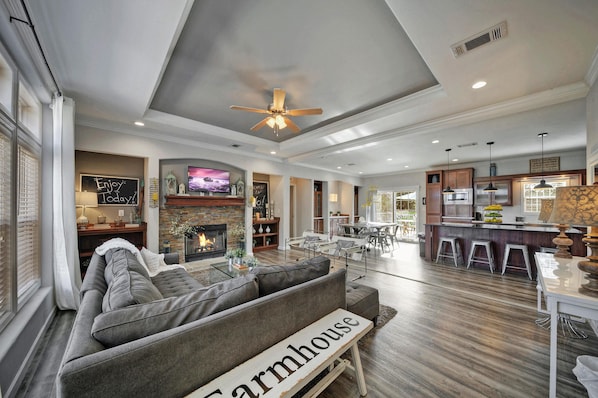 Living Room with Fireplace, Dining Room &amp; Kitchen