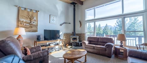 Wood burning fireplace and expansive mountain views.