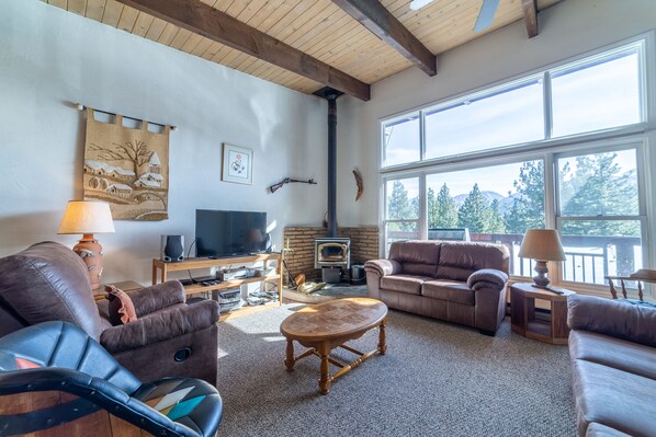 Wood burning fireplace and expansive mountain views.