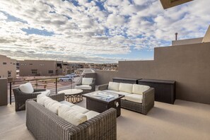 Upstairs Patio View - Stay warm next to the fire-pit and relax while watching the sunset over the red mountains.