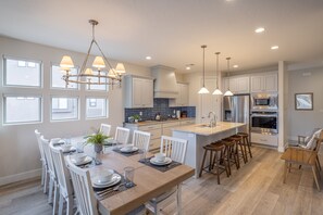 Dining Table & Kitchen - Share memories and stories while enjoying a family style meal around the Dining Table.