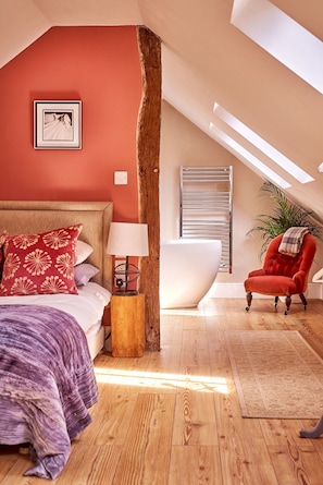 The bedroom and bath tub at The Old Forge, Peak District