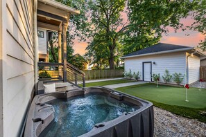 The hot tub comfortably accommodates up to 6 guests, perfect for unwinding.