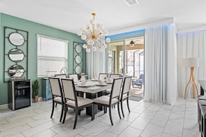 Beautiful open-concept dining room with pool views while you enjoy your meal.