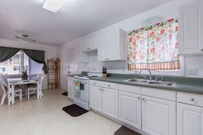 Dining and Kitchen area. Side entrance to house