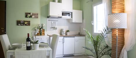 Dining table and kitchenette.