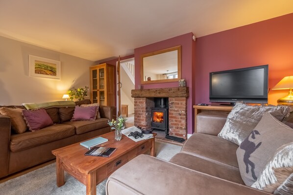 Ayres Cottage, Burnham Thorpe: Comfortable sitting room with wood burning stove