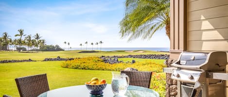 Ocean and rolling golf course views from your outdoor dining area equipped with a BBQ grill.