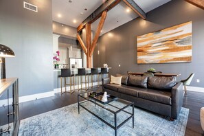 Open concept living, kitchen, and dining area with lots of comfortable seating options for you and your guests. 65” Samsung Smart 4K TV that allows for streaming from your favorite apps, along with the DIRECTV Entertainment. The sofa also converts to a queen-size sleeper sofa! Dining table with seating for four. All the natural light too!