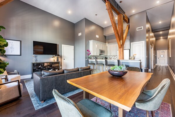 Open concept living, kitchen, and dining area with lots of comfortable seating options for you and your guests. 65” Samsung Smart 4K TV that allows for streaming from your favorite apps, along with the DIRECTV Entertainment. The sofa also converts to a queen-size sleeper sofa! Dining table with seating for four and four at the bar too. All the natural light too!