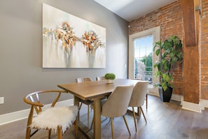 Cook and dine easily in the fully stocked kitchen, equipped with all stainless steel appliances, gas range, basic cookware, and a dining area for a comfortable meal at home. Entertain at the bar with seating for four.