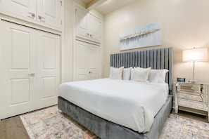 Spacious guest bedroom 1 featuring king size bed and designer built in closet. The bedroom is equipped with hangers, luggage rack, white noise machine and 50'' Samsung Smart 4K TV for streaming from apps, along with the DIRECTV Entertainment.