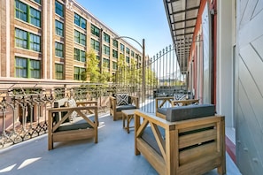 Extra deep balcony with cozy sectional and coffee table. Perfect for morning and evening relaxing!